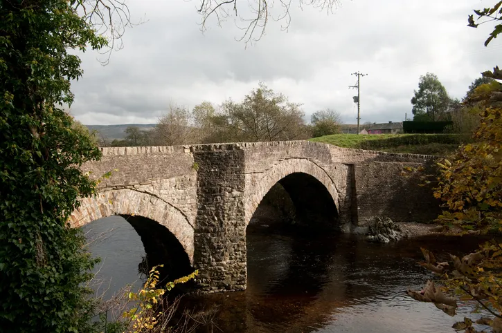 The Grade II listed building that is the 17th Century Millthrop Bridge over the River Rawthey south of the book town of Sedbergh in Cumbria. This bridge is in the Yorkshire Dales National Park.