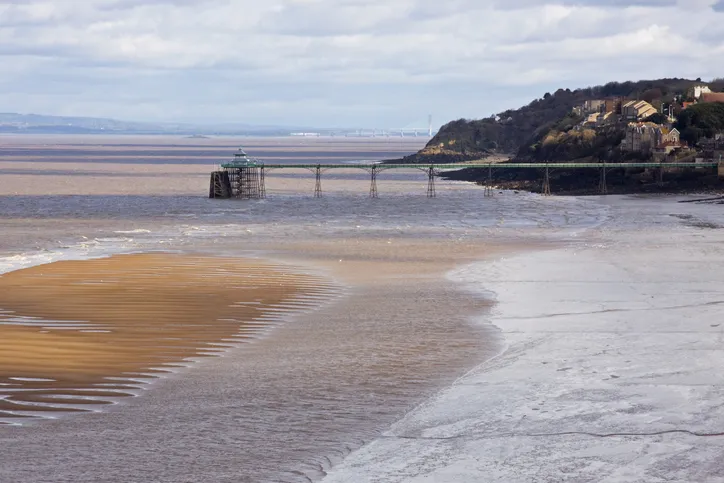 View of the Victorian pier at Clevedon in Somerset, UK. As well as providing access for promenaders it is still used as a landing stage in summer for passengers embarking on trips around the coastline and across the Bristol Channel to South Wales