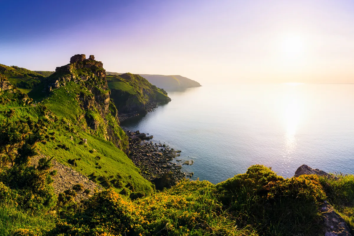 Valley of the Rocks and Wringcliff Bay at sunset in Exmoor National Park, Lynton, England. (Photo by: Loop Images/UIG via Getty Images)