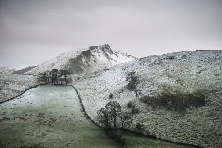 Beautiful Winter landscape image of Chrome Hill and