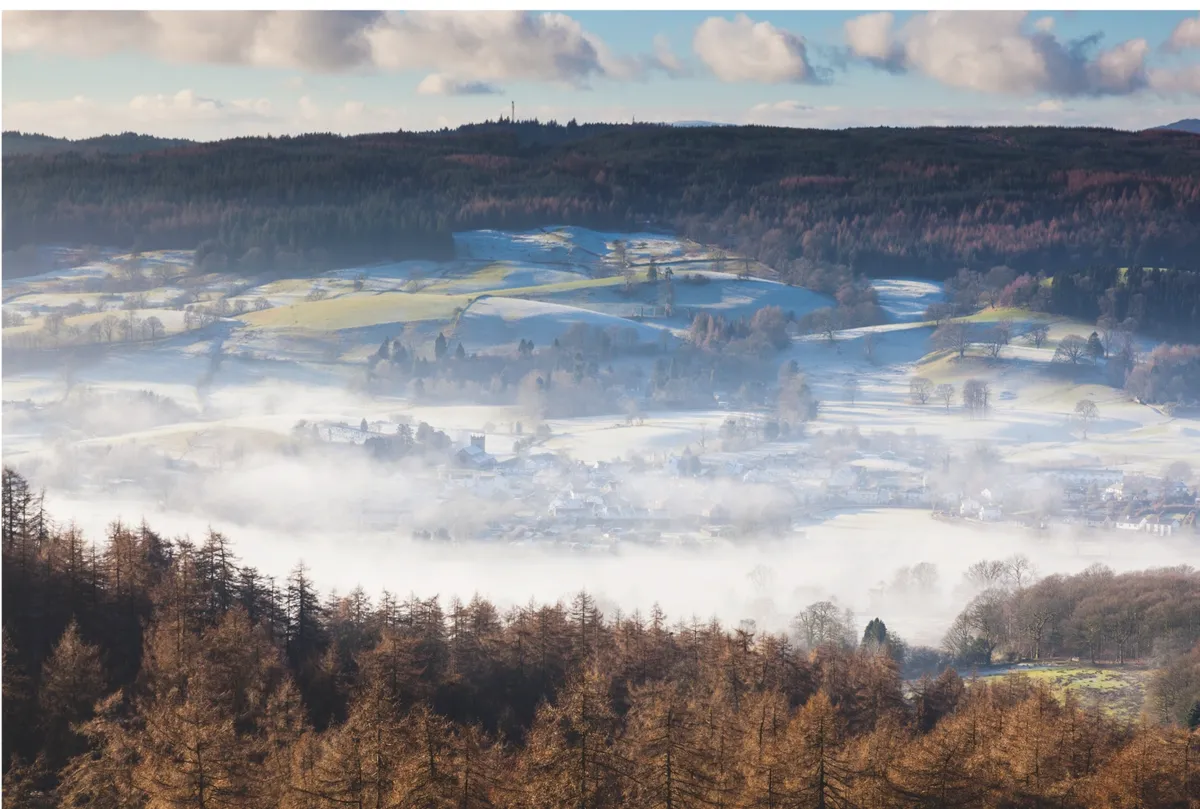 Winter veil: the village of Hawkshead in the Lake District National Park wakes to a blanket of thin frost and low-lying mist