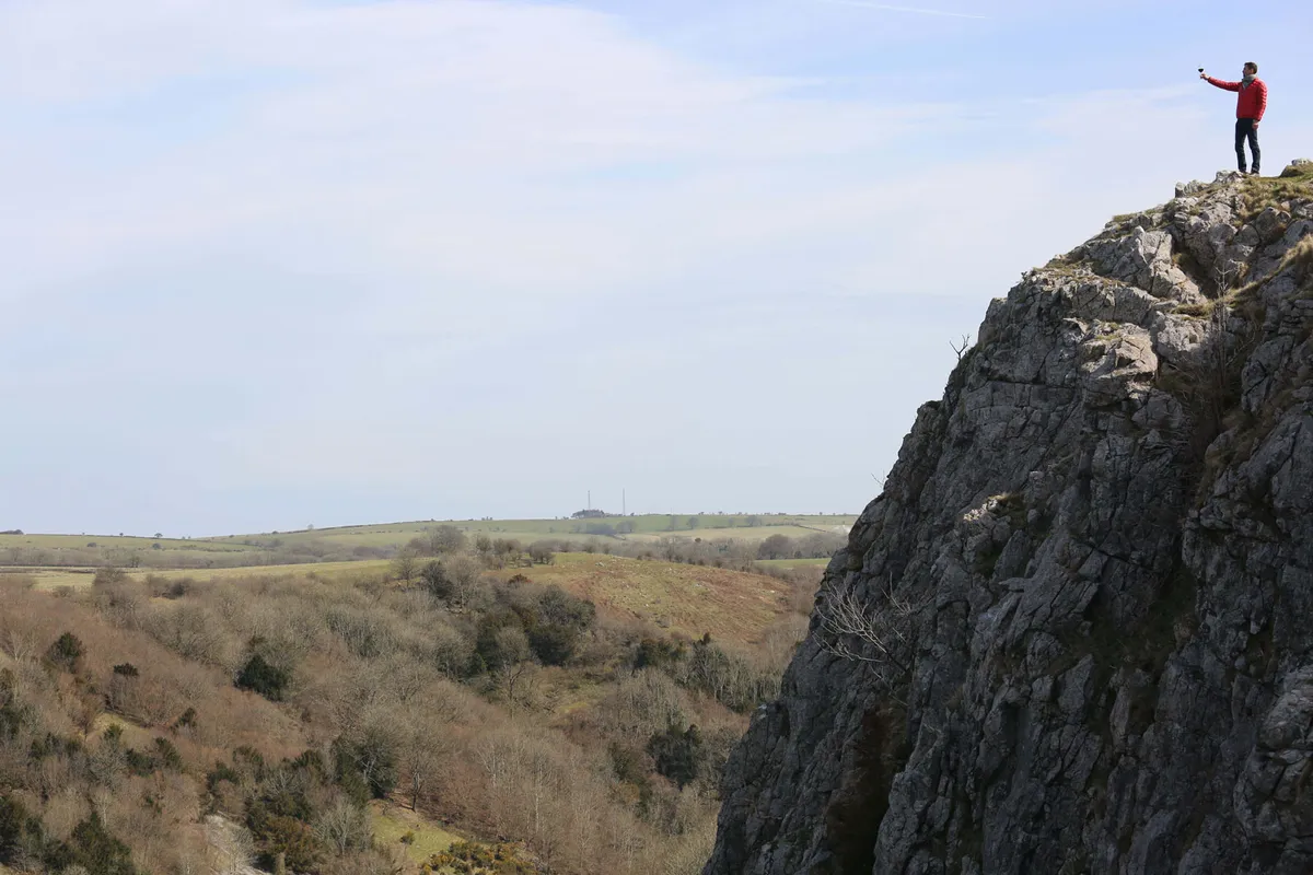 Kenton-Cool-at-the-top-of-Cheddar-Gorge-raising-a-glass-of-Trivento-to-his-top-10-UK-micro-adventures5B35D5B15D-cfdad64