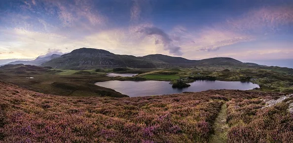 Panorama sunrise landscape over Cregennen Lakes with Cadair Idris in background. (Photo by: Loop Images/UIG via Getty Images)
