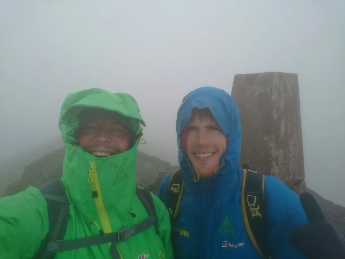 Two male hikers in the rain