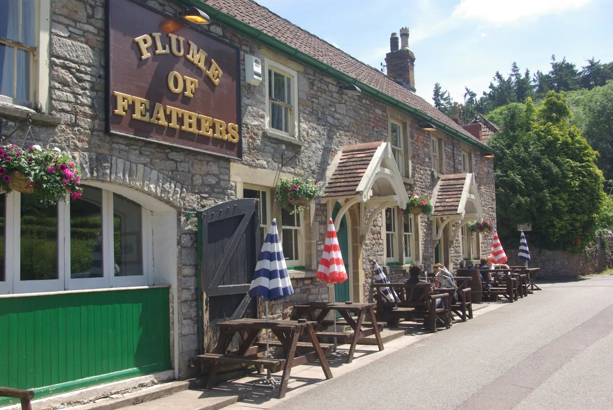 Exterior view of country pub with tables outside