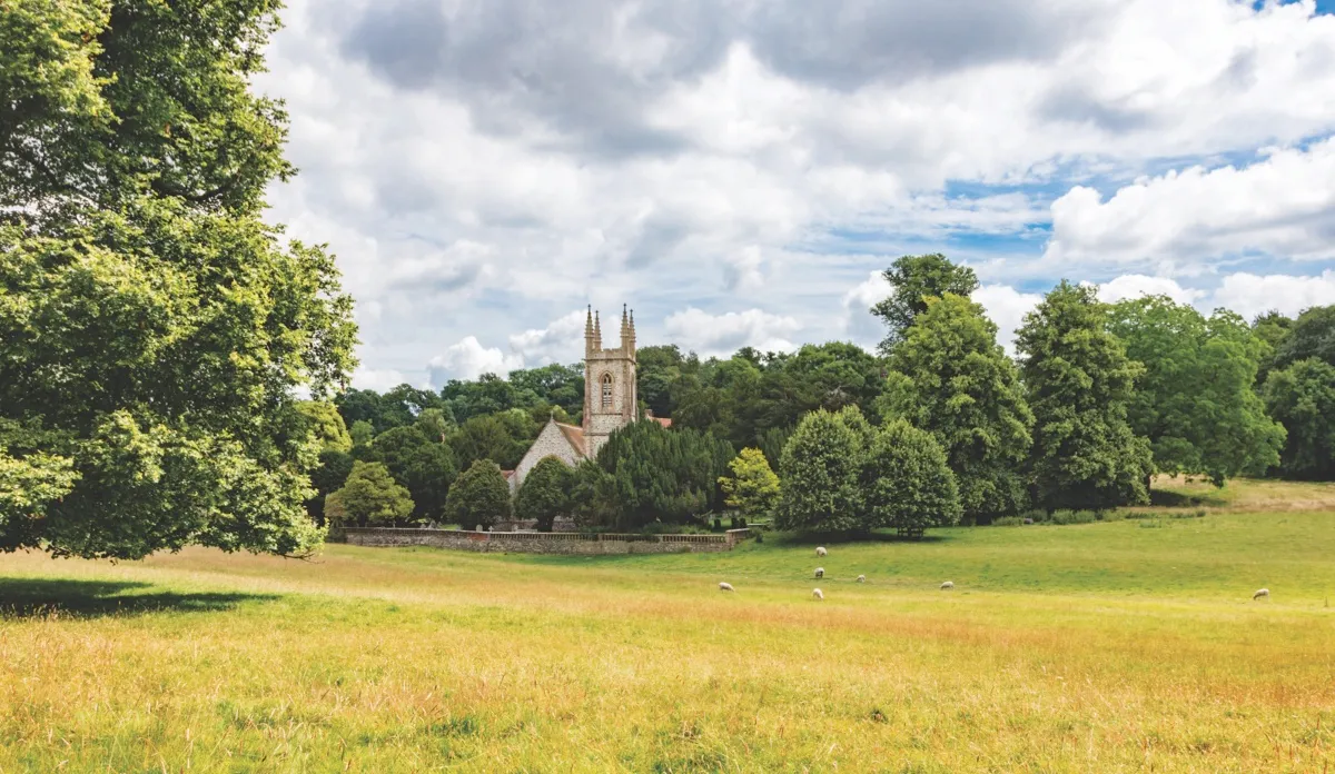 GX1DYX St Nicholas Church nestled amongst the trees on the Chawton House parkland, Hampshire, UK