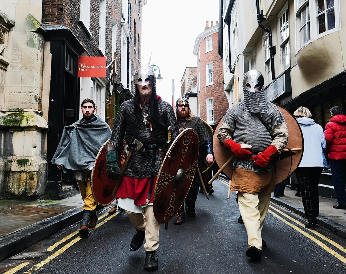 Vikings march down the road in York, home to the Jorvik Viking Centre