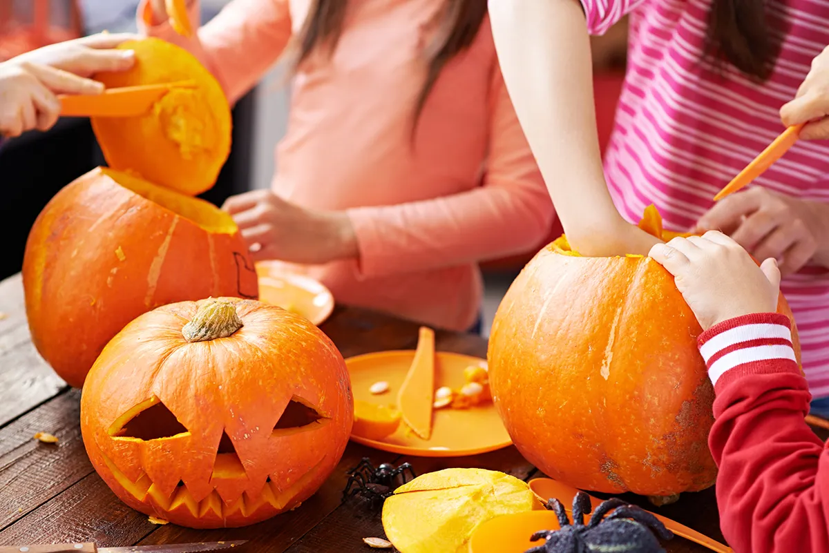 Children making Halloween Jack Oâlanterns