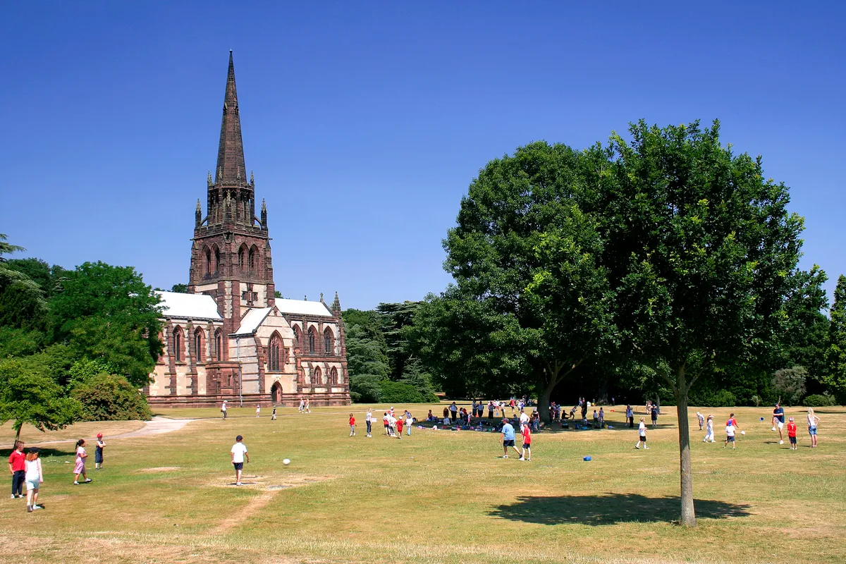 Visitors outside the Anglican Church of St. Mary the Virgin at Clumber Park, a country park in the Dukeries near Worksop in Nottinghamshire. (Visitors outside the Anglican Church of St. Mary the Virgin at Clumber Park, a country park in the Dukeries n
