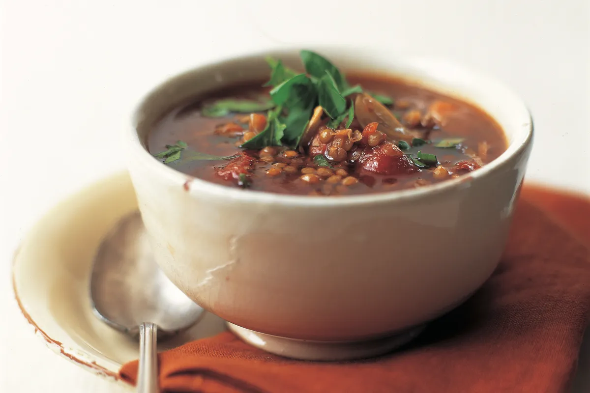 Country lentil soup in a bowl with a spoon