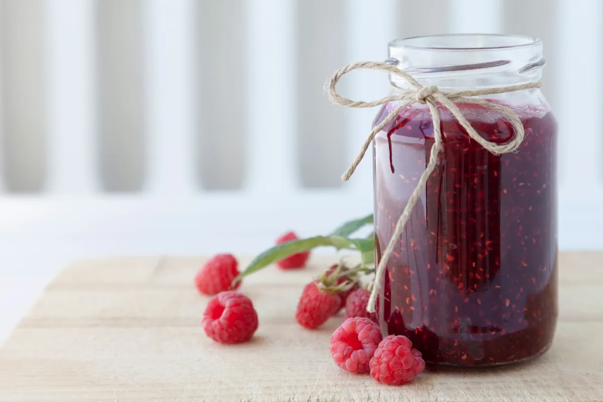 Raspberry jam on table