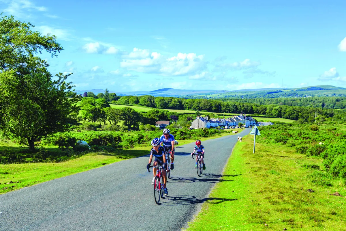 Cyclists on the road near Clearbrook, Dartmoor National Park, Devon