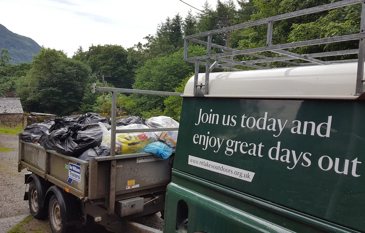 National Trust rangers clearing up rubbish left by campers at Ullswater in the Lake District