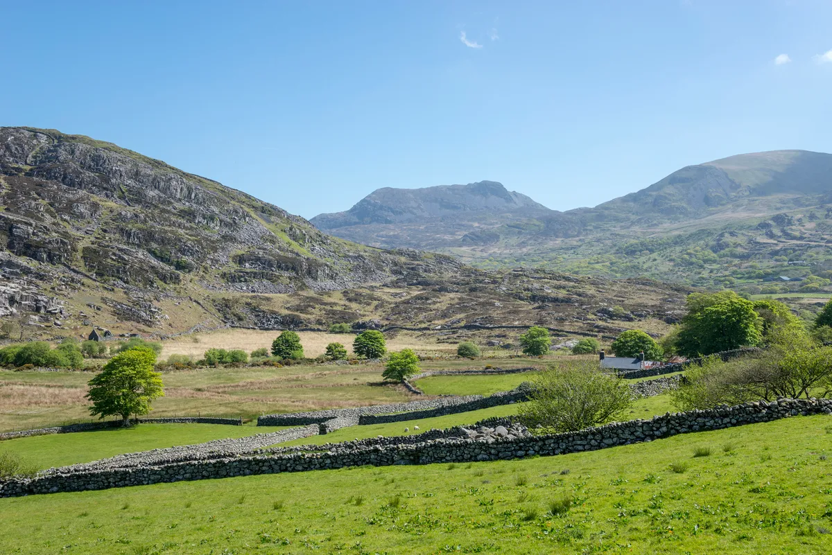 Remote Welsh landscape with isolated farms below the mountains known as the Rhinogs