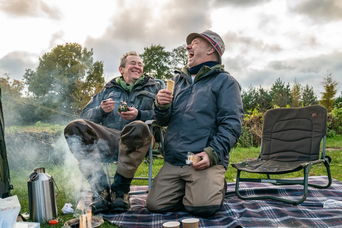 Programme Name: Mortimer & Whitehouse: Gone Fishing S3 - TX: n/a - Episode: Mortimer & Whitehouse: Gone Fishing S3 - iconic (No. n/a) - Picture Shows: picnic beside a Norfolk lake. Paul Whitehouse, Bob Mortimer - (C) Owl Power - Photographer: Pete Dadd