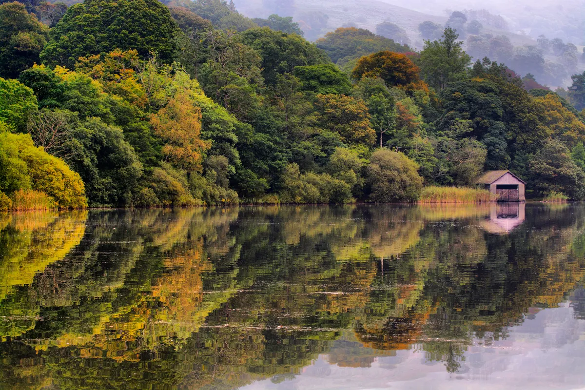 Rydal Water surrounded by autumn woodland
