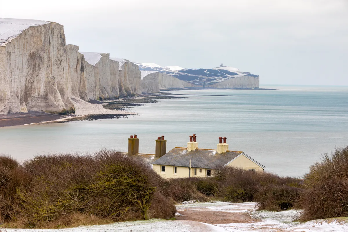 Snow on cliffs by the sea