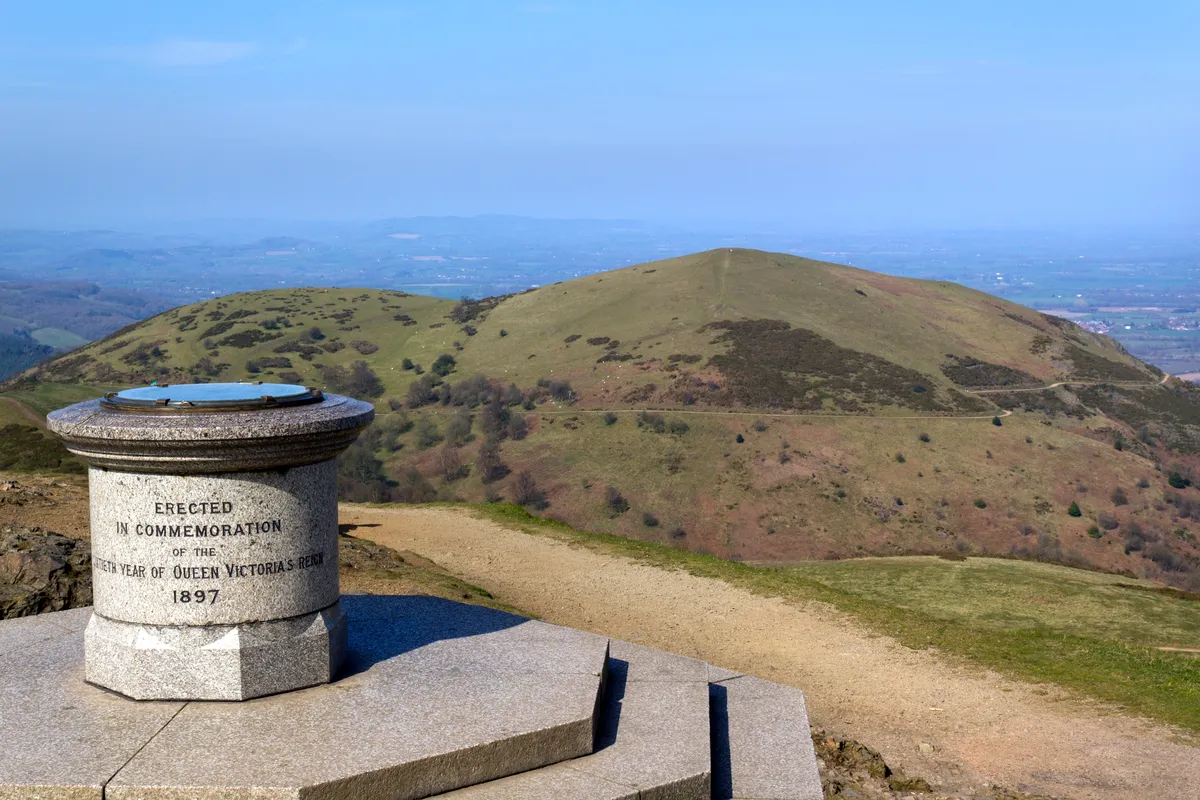 The toposcope and memorial on Worcestershire Beacon, the highest point on the Malvern Hills , Worcestershire, UK./Credit: ChrisAt/iStock/Getty Images Plus.