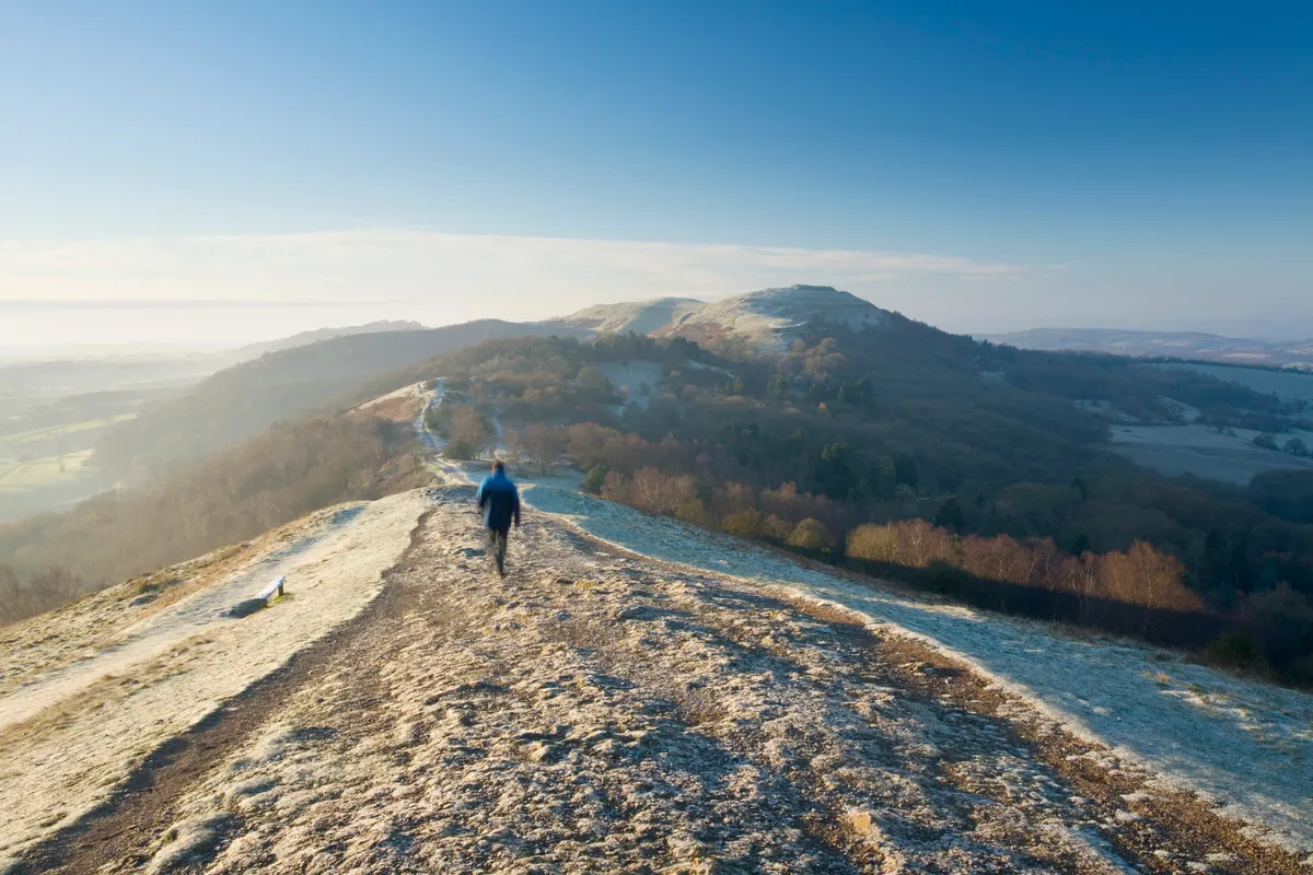 Caucasian Male Walker (29 Years Old) on the Malvern Hills on a frosty winter morning. Herefordshire & Worcestershire. England. UK. (Caucasian Male Walker (29 Years Old) on the Malvern Hills on a frosty winter morning. Herefordshire & Worcestershire. E