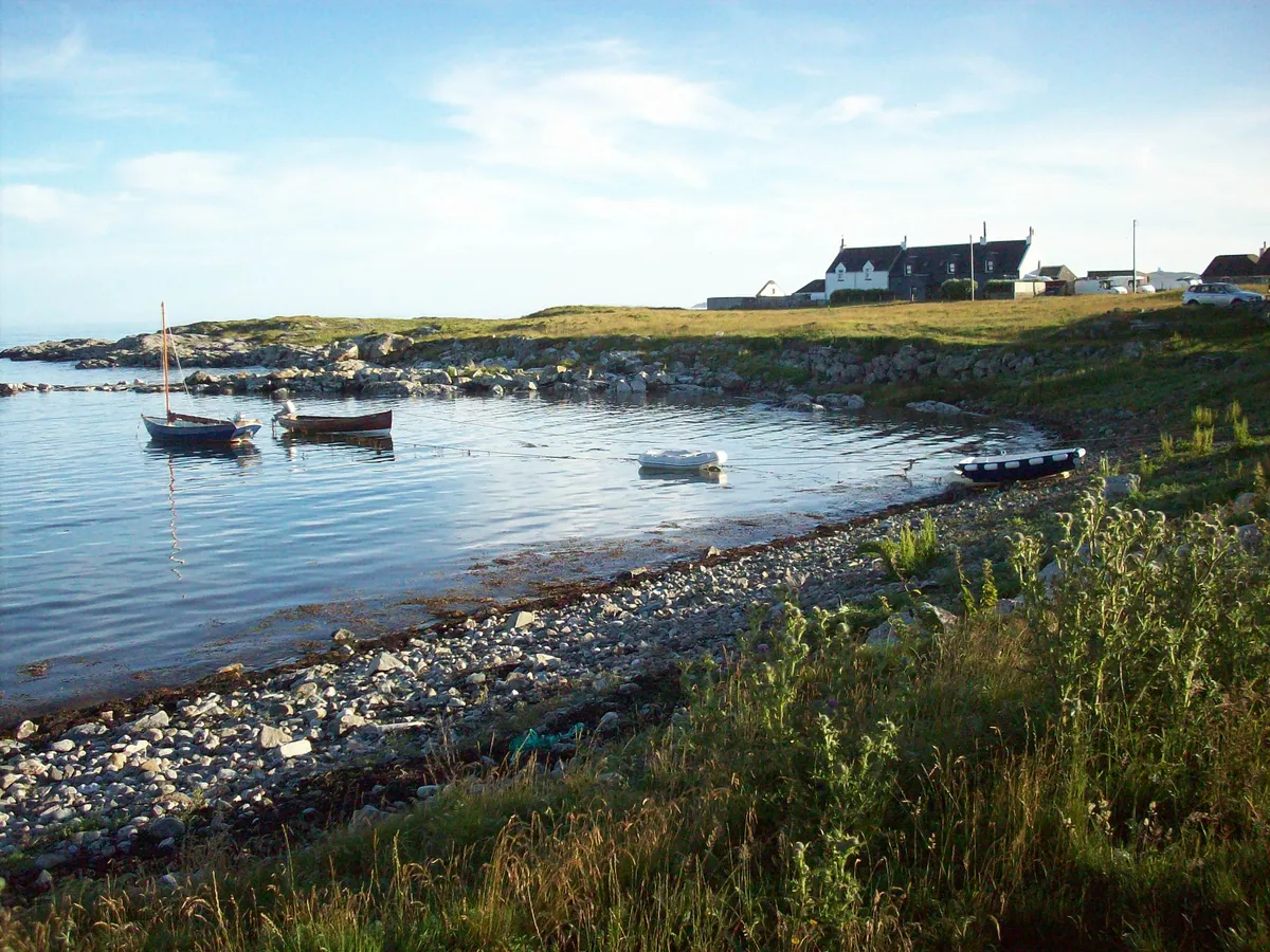 Shale harbour with fishing boats on the isle of Tiree in Scotland