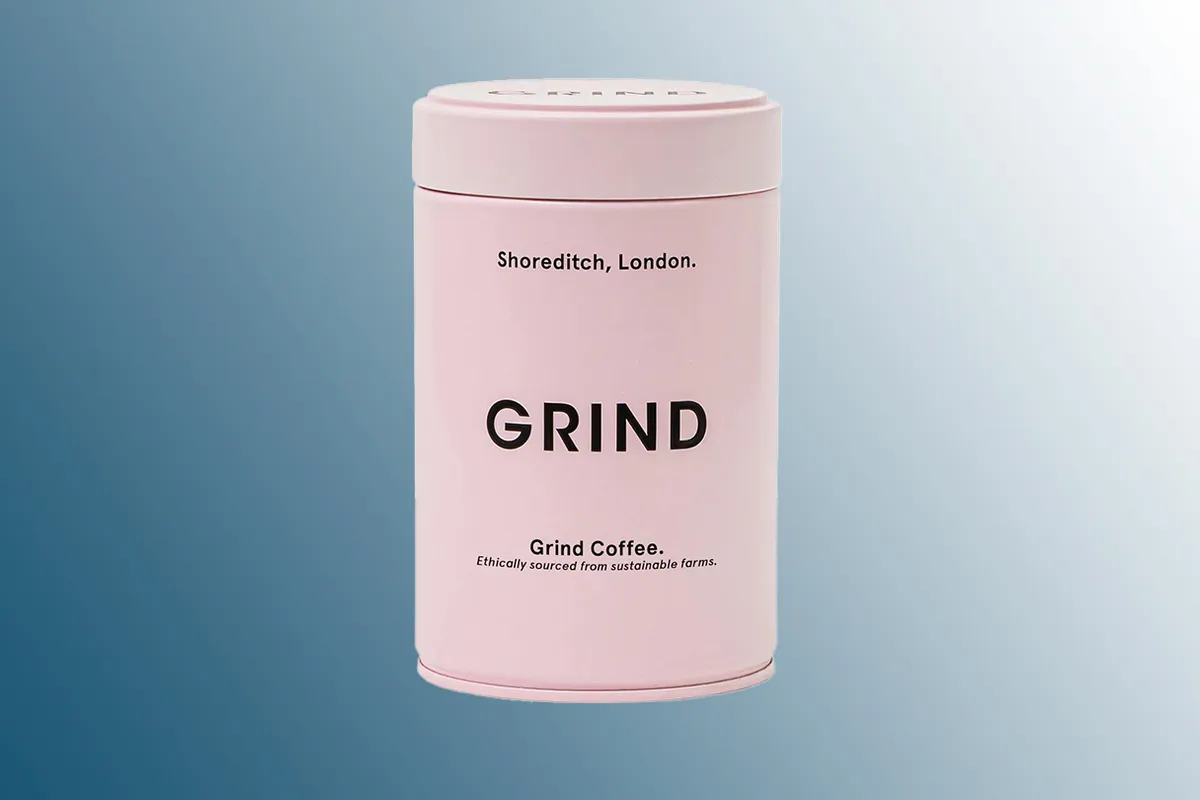 Grind Organic Whole Bean & Ground Coffee on a blue background