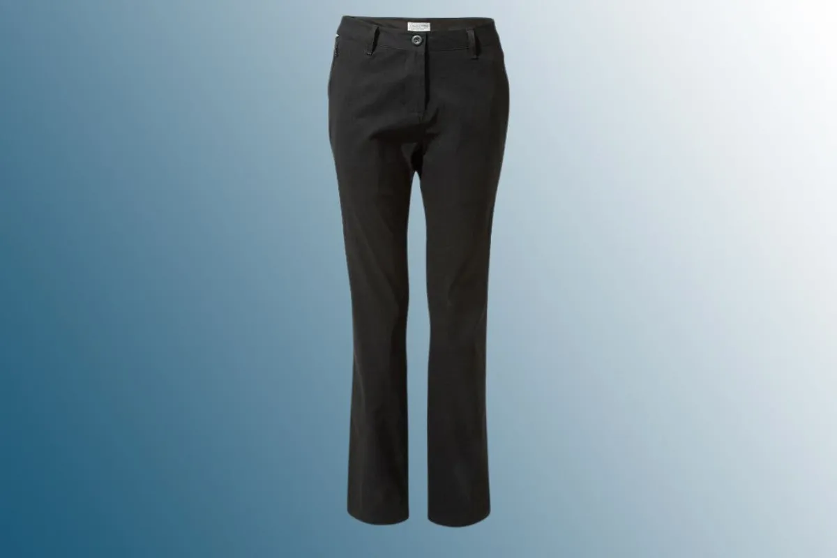 Black walking trousers on blue background 