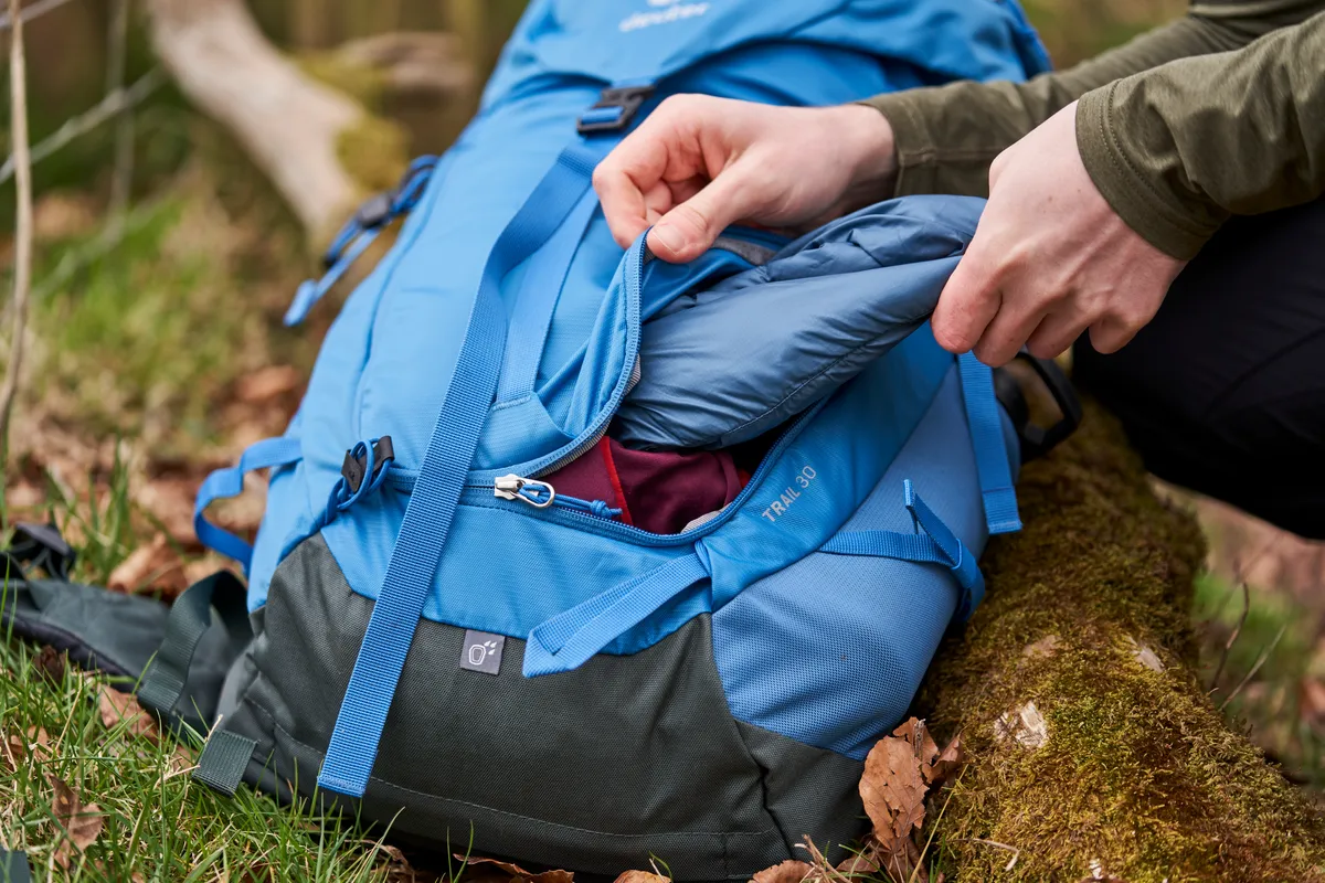 Close-up of hands using Deuter Trail 30 backpack
