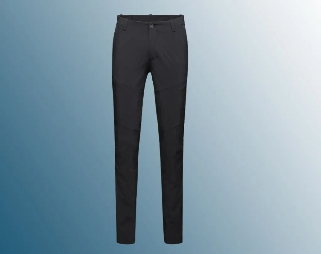 Black walking trousers on blue background 