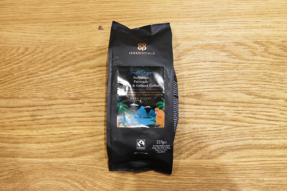 Co-Op Sumatran Fairtrade coffee on a wooden table