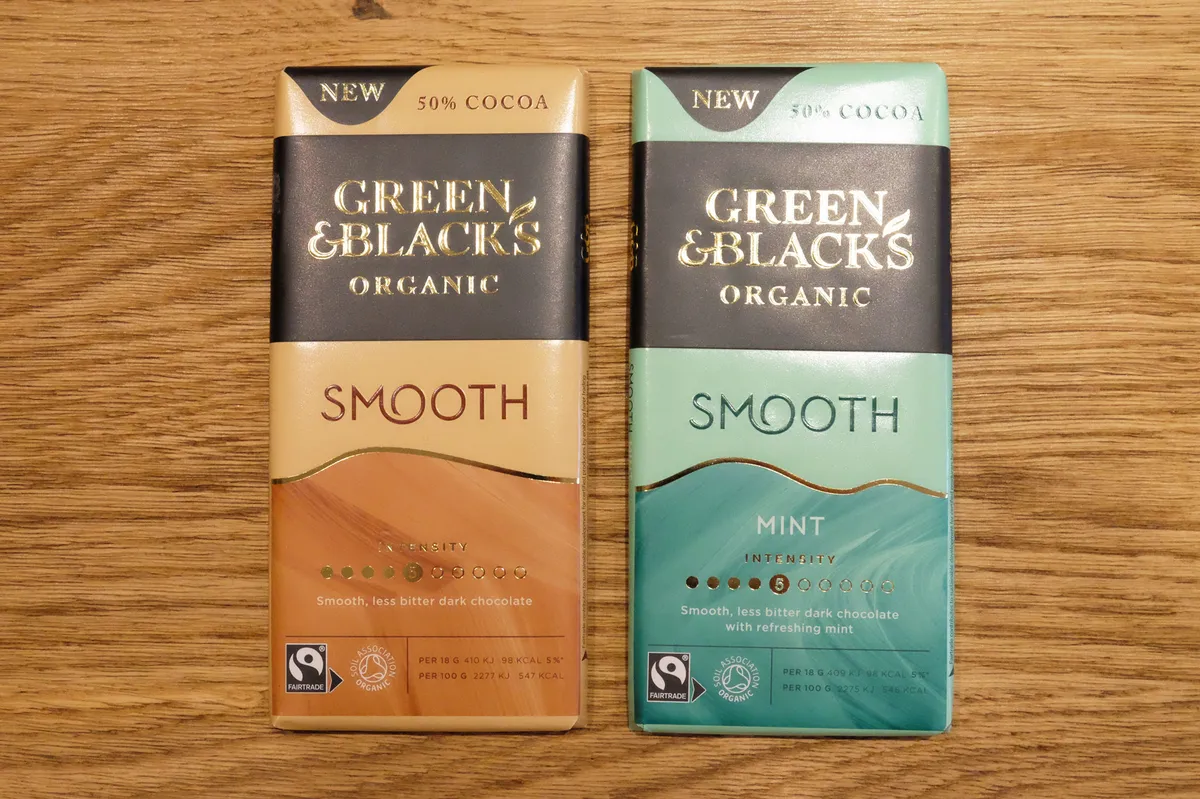 Green & Black's Organic Smooth Chocolate Bars on a wooden table
