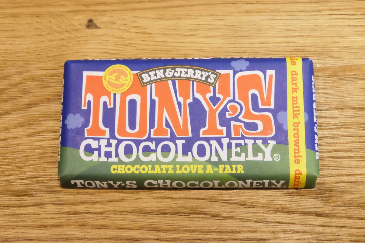 Tony's Chocolonely Dark Milk Fudge Brownie Bar on a wooden table