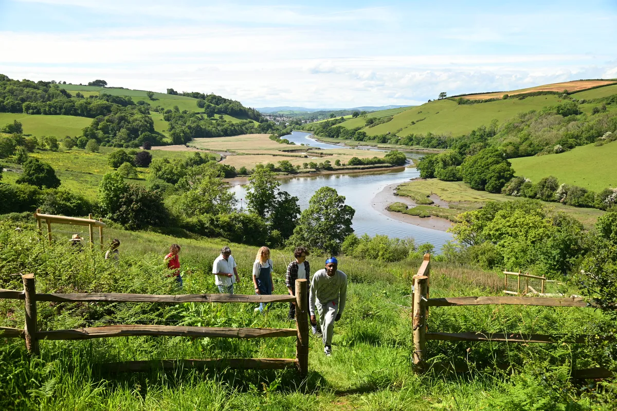 Coach House retreatants connect with the rewilding area at The Sharpham Trust 01