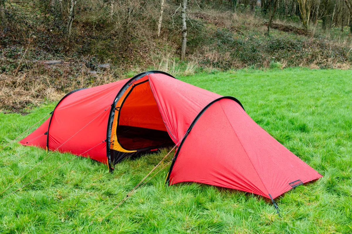 Red backpacking tent for two, with porch