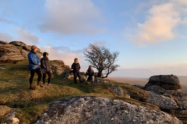 Four people on Dartmoor at sunset