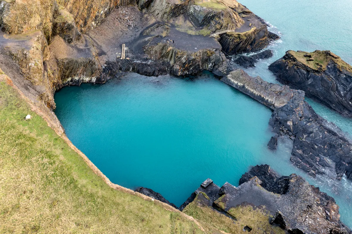 Aerial view of a rocky coastline and Blue Lagoon in Pembrokeshire