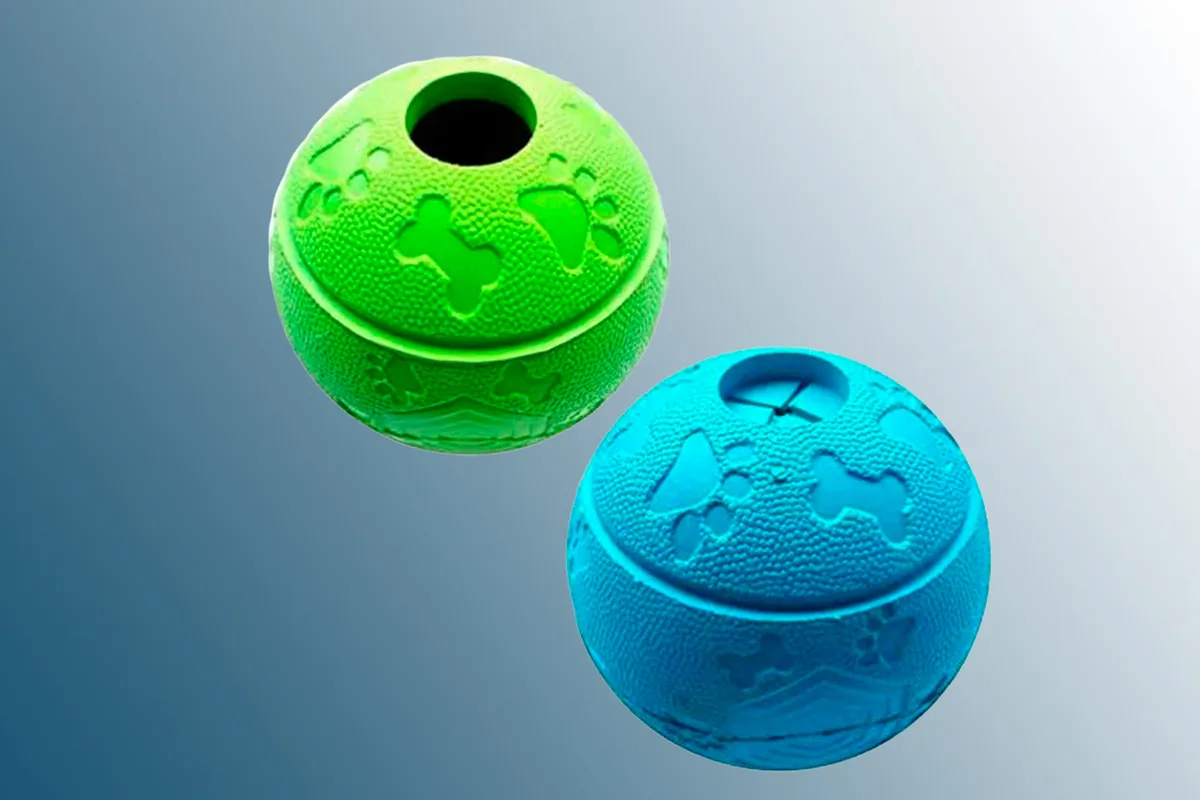 Dog treat interactive balls on a blue background