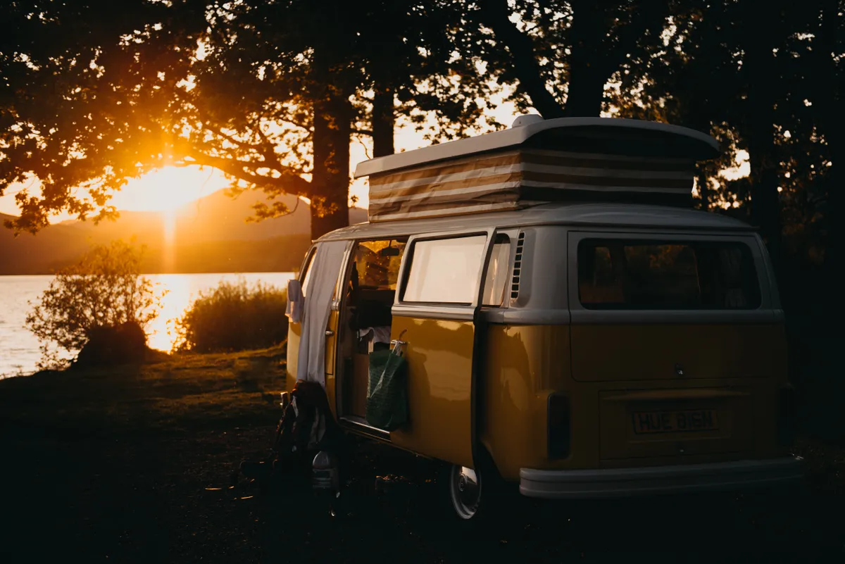 Yellow campervan at sunset