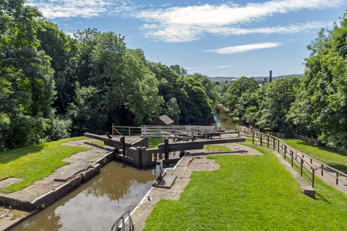 Bingley Five Rise Locks on a sunny summer day with blue sky