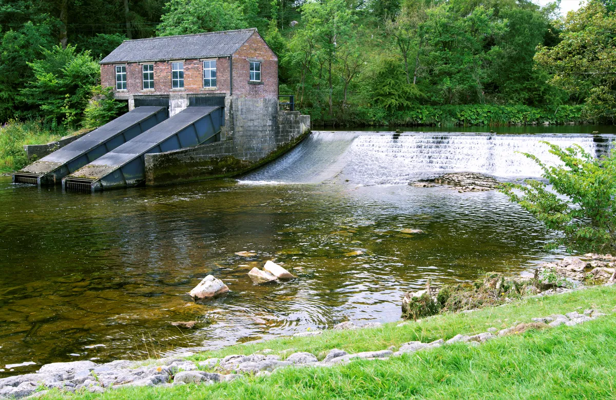 Water tumbles down the weir at Linton Falls near Grassington in the Yorkshire Dales
