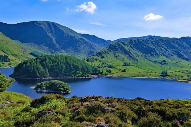 The islands in Haweswater in the Lake District with blue sky