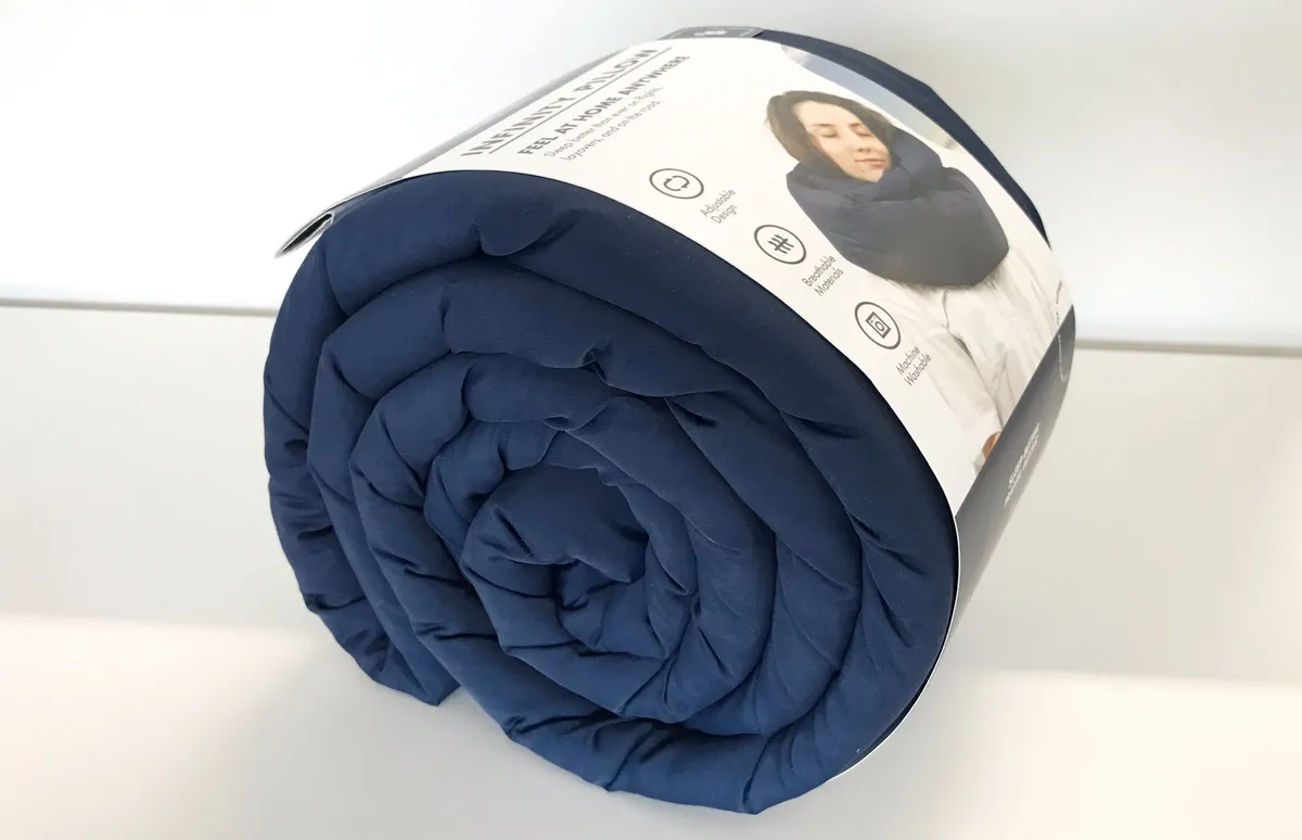 Infinity Pillow rolled up on a white table