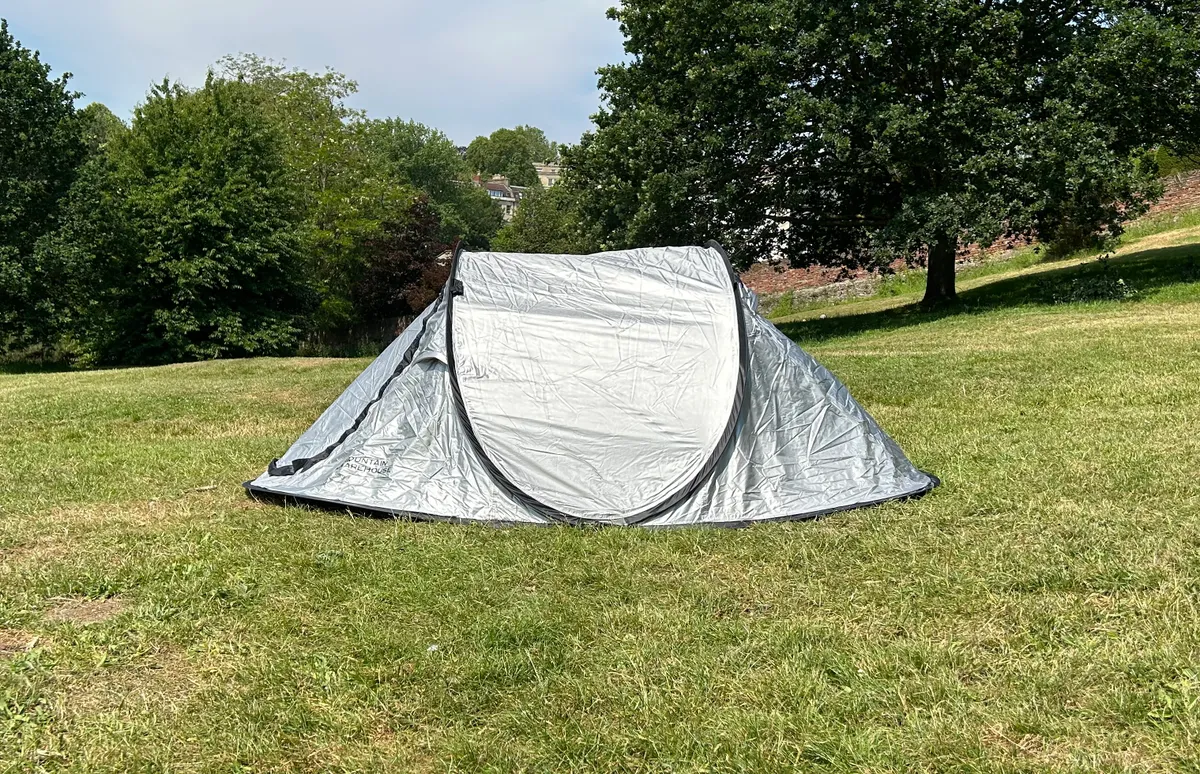 Mountain Warehouse Black Out Pop-Up Double Skin 3 Man Tent on grass