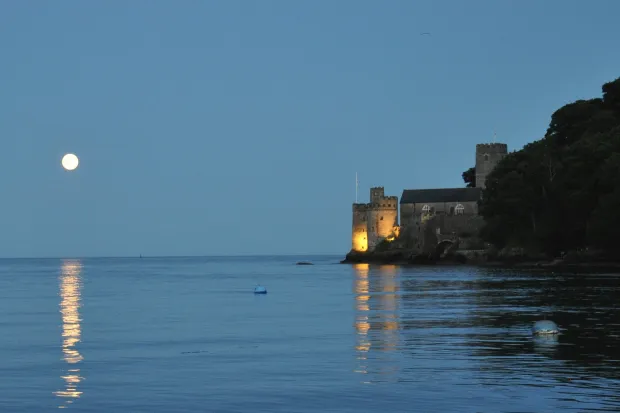 Dartmouth Castle with moonlight and sea