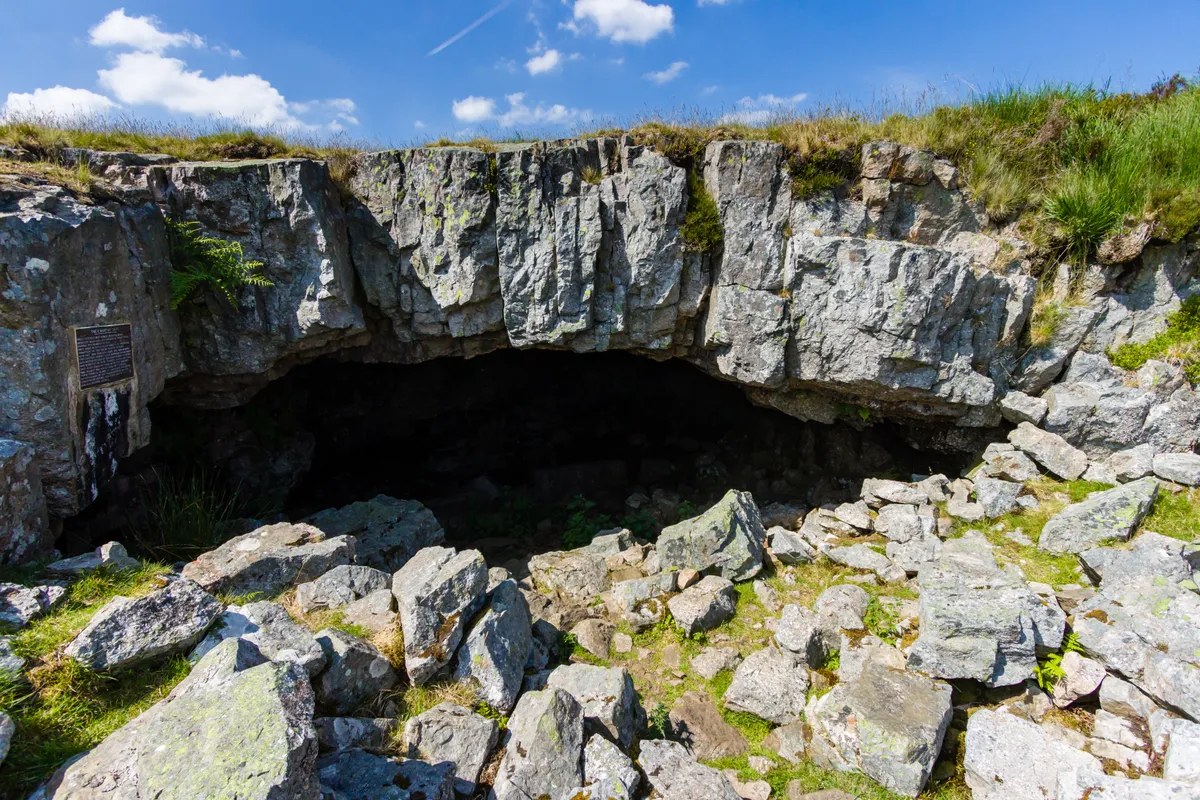 Chartist Cave entrance with blue sky