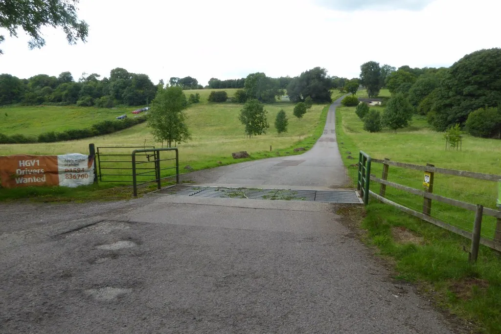 Entrance to Clearwell Farm with trees and fields