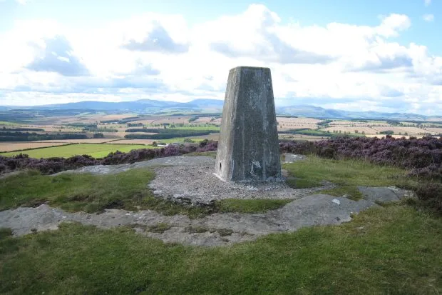 Trig point on Greensheen Hill with blue sky and clouds