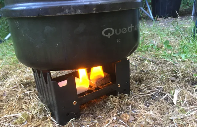 Camping pot on solid fuel stove