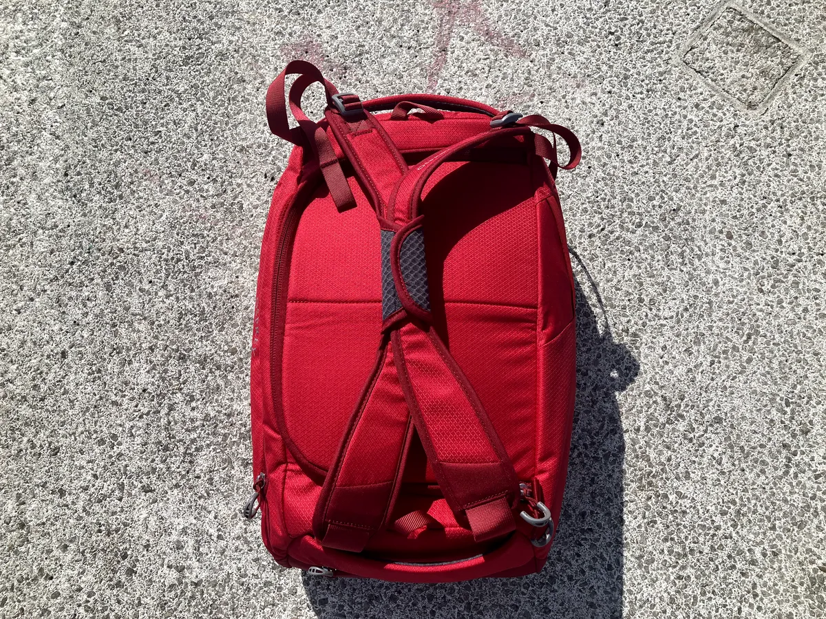 Red duffel bag on the ground