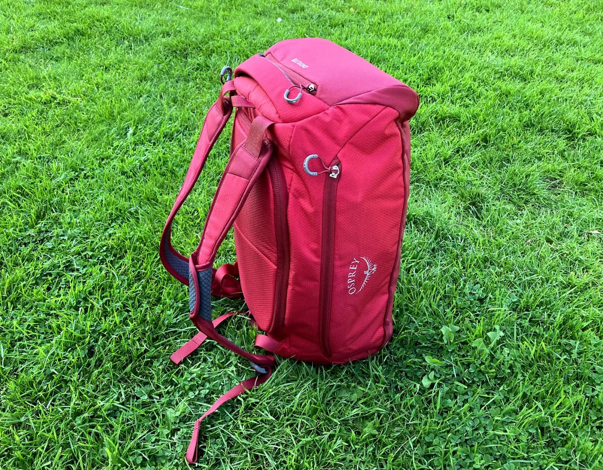Red duffel bag on grass