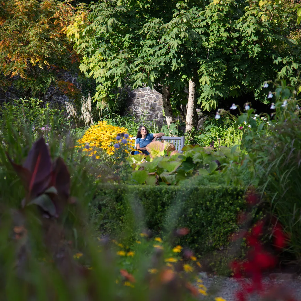 Woman sitting in Dunvegan Castle and Gardens